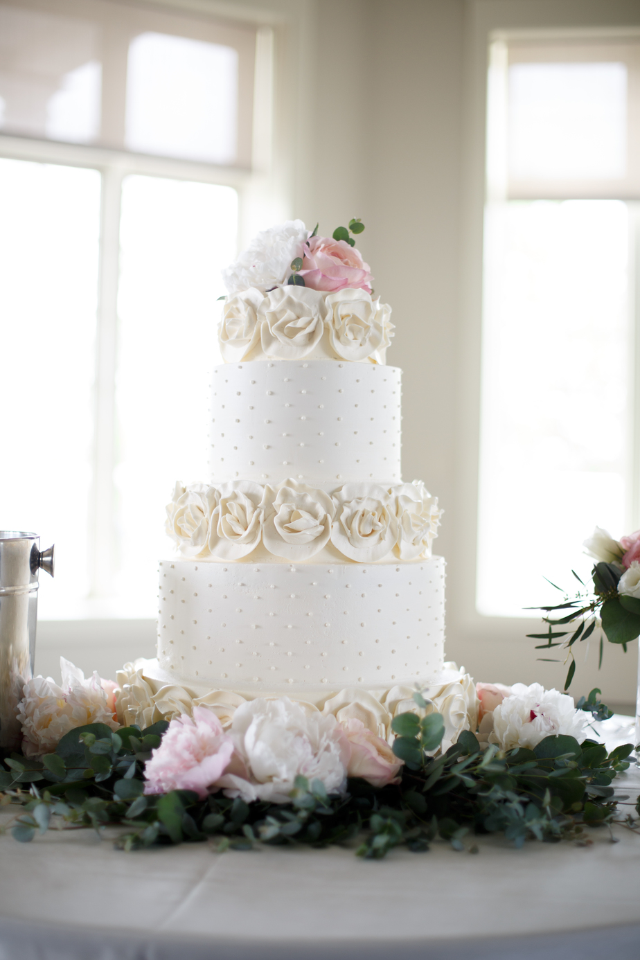 White wedding cake with flower detail - Hallbrook Country Club