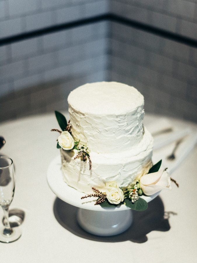 white wedding cake with floral accents