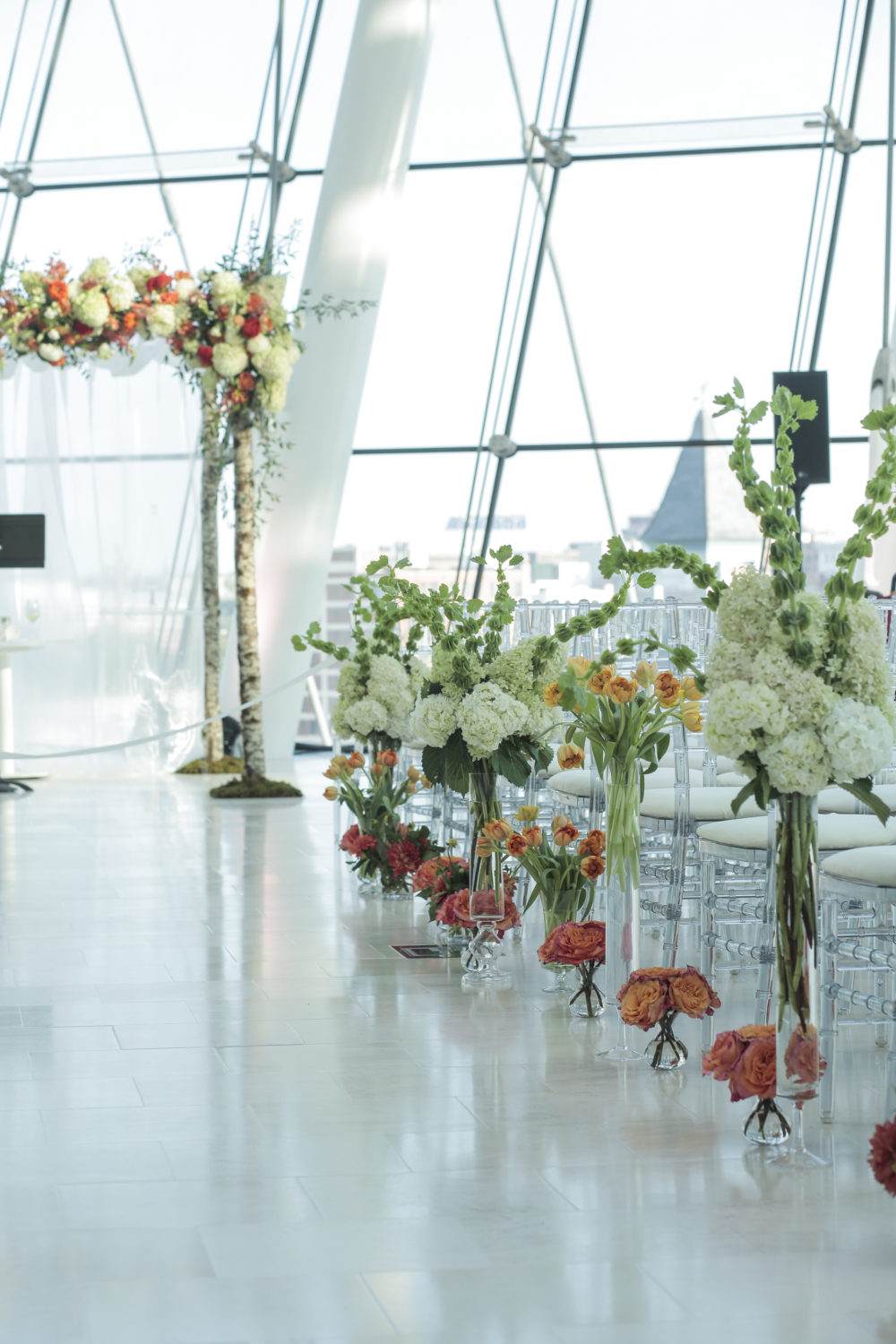 wedding aisle floral decor and chuppah