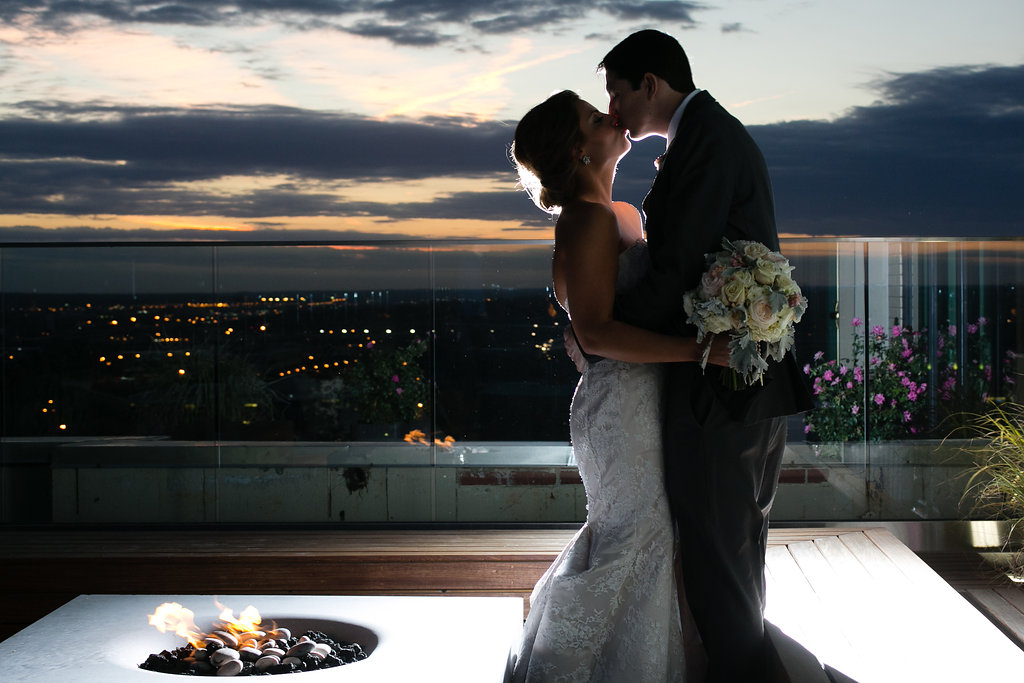 downtown Kansas City wedding rooftop kiss