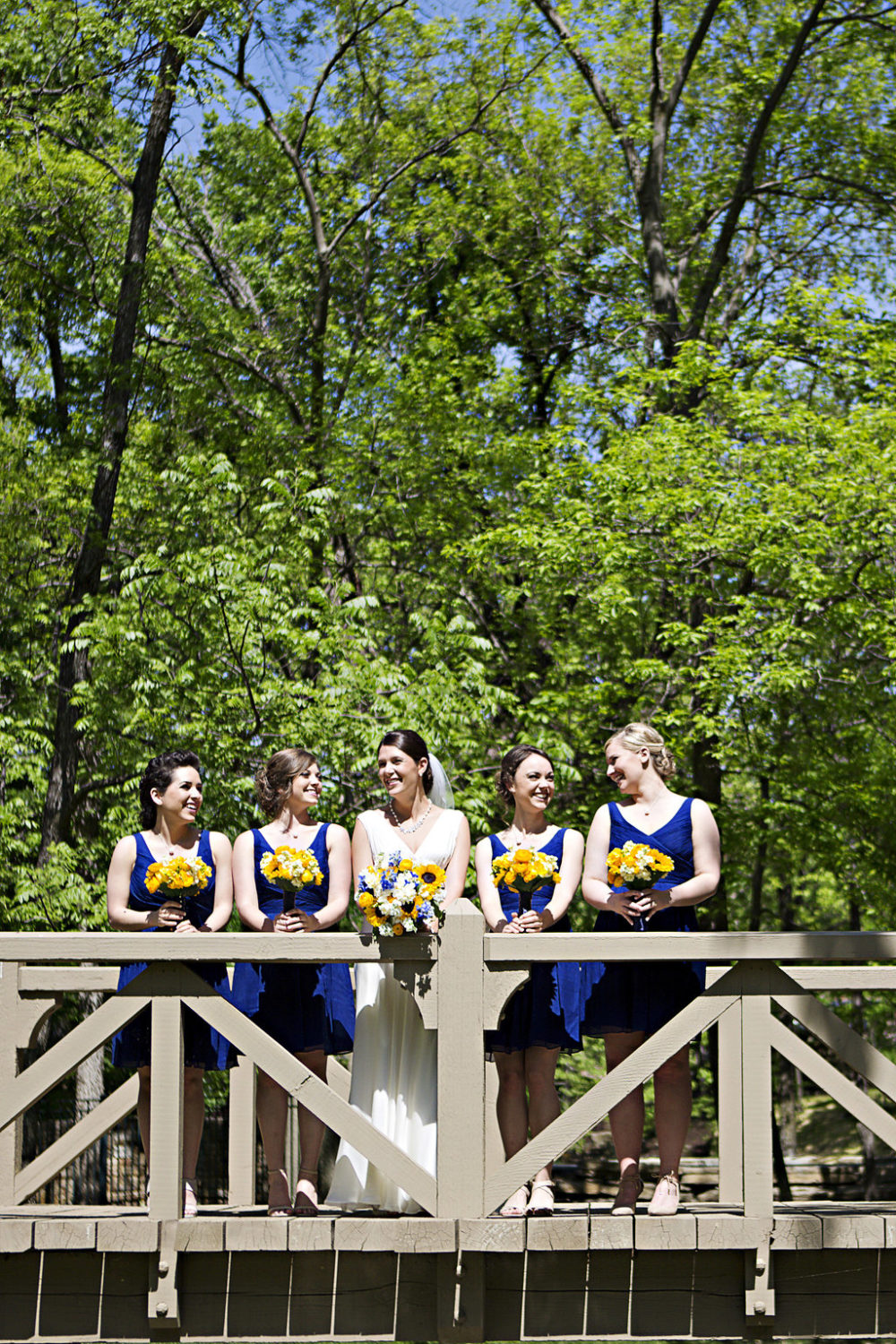 Bright floral bridesmaids bouquets Sidelines Floral